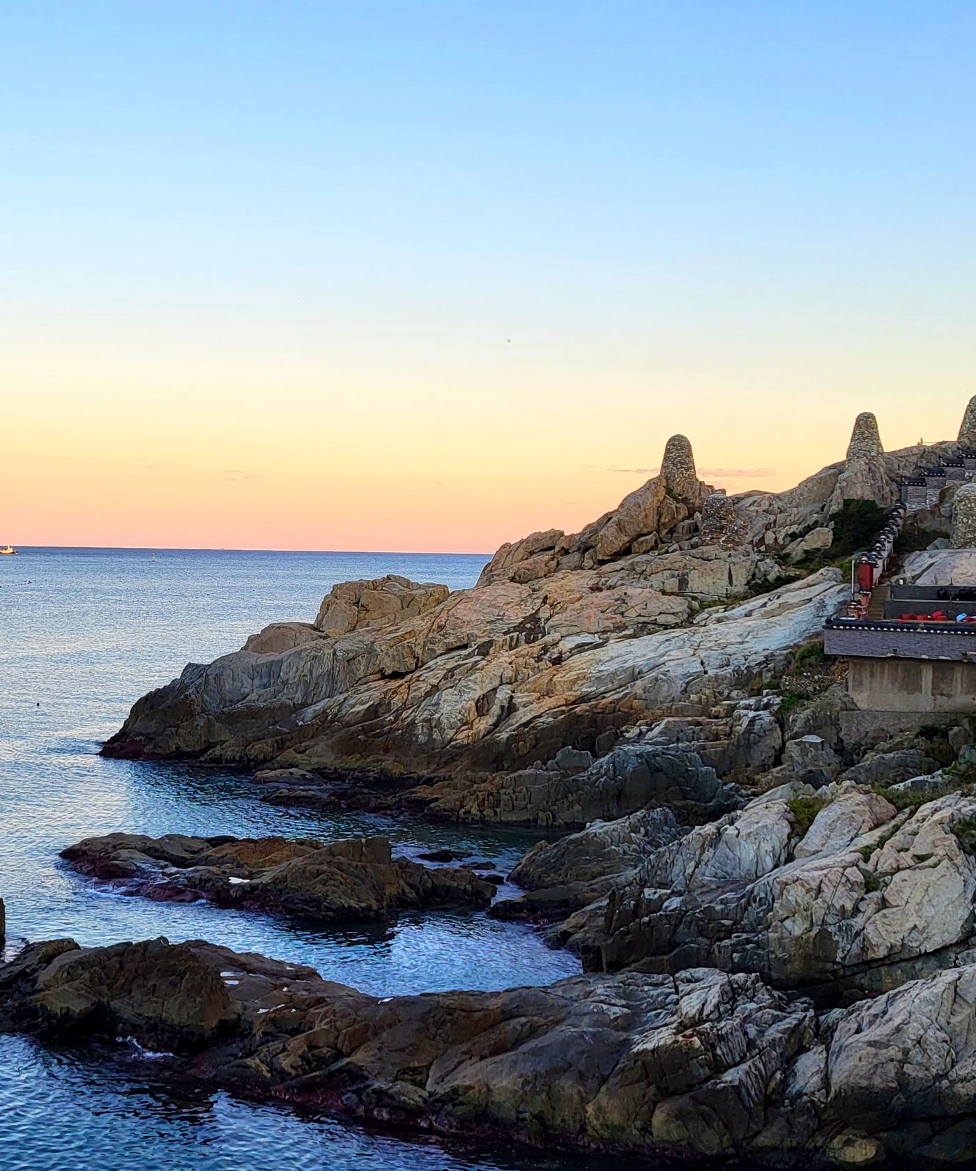 Haedong Yonggungsa, a seaside temple in Busan, in warm evening light